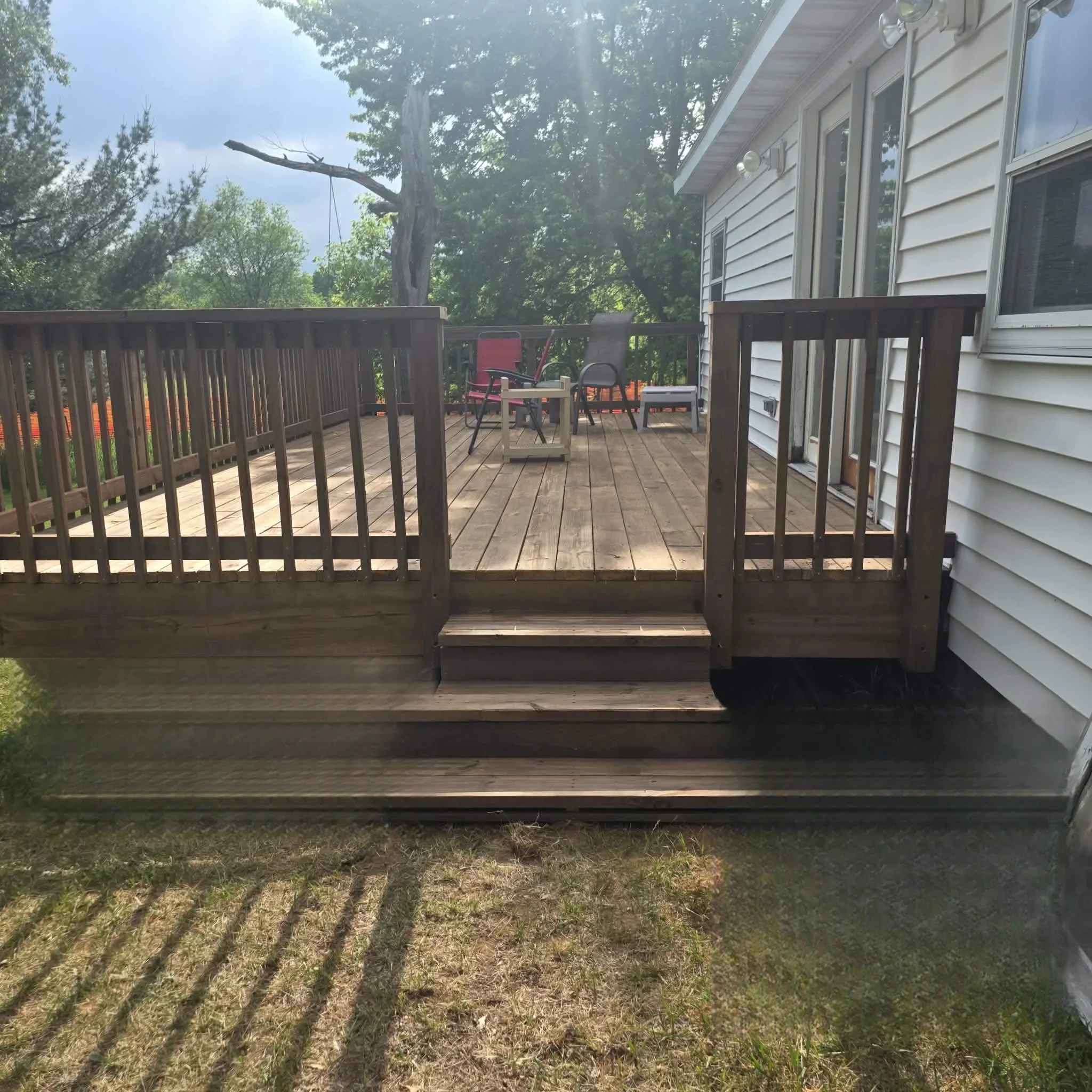 Completed Treated Wood Deck with 4-Step Staircase